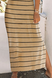 Camel maxi dress with horizontal black stripes and a side slit hem.