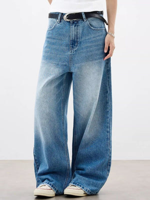Relaxed fit vintage wash blue cotton jeans with a baggy cut and pocket detail.