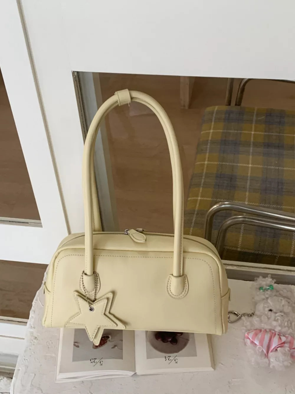 Yellow shoulder bag with star charm and top handles