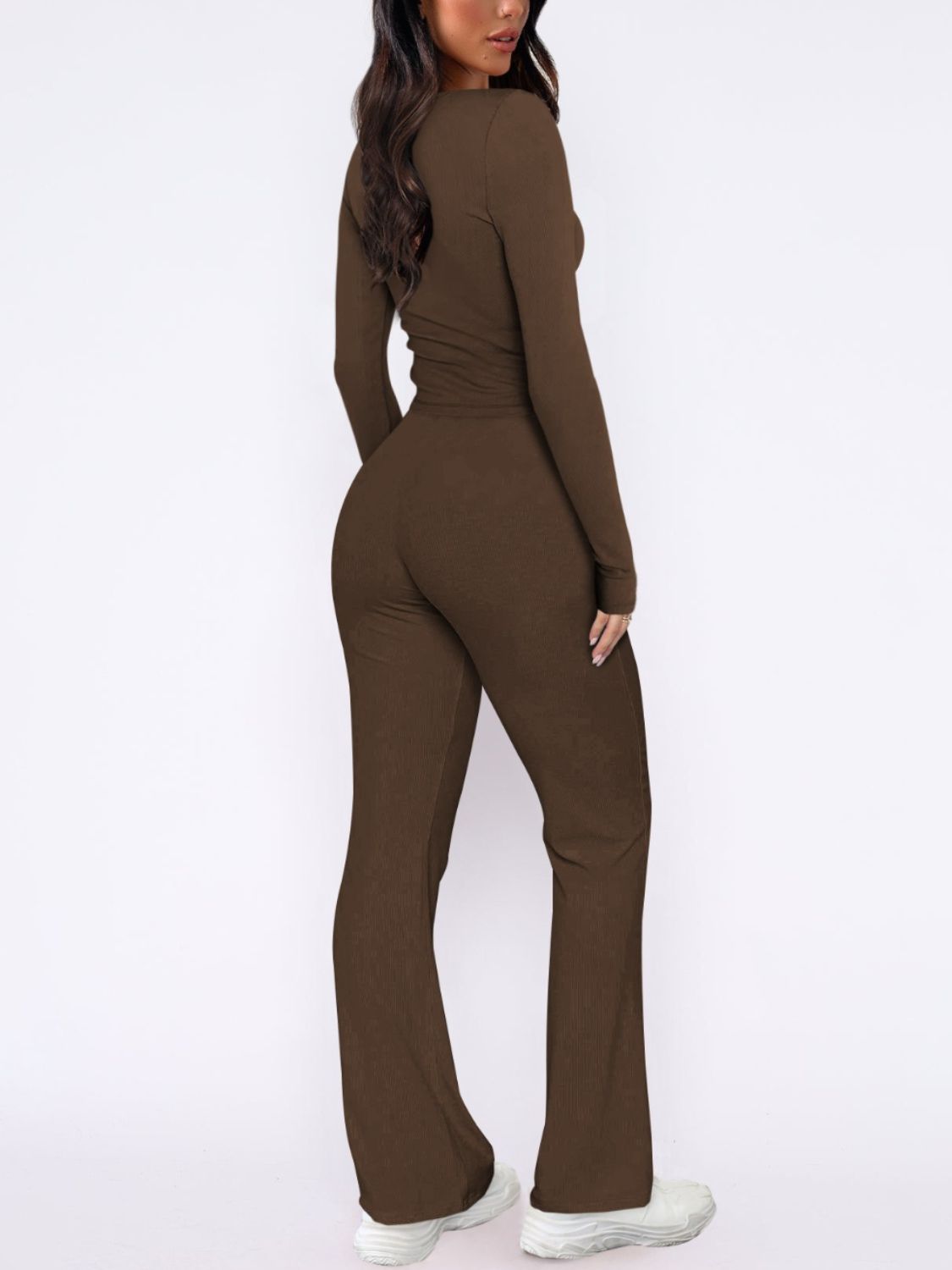 Brown ribbed loungewear set with long sleeves and flared pants.