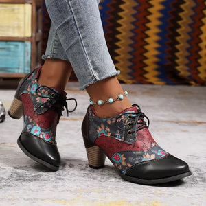 Floral patchwork lace-up ankle boots with block heel in red, black, and blue floral print.