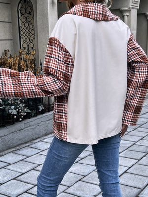 Houndstooth plaid contrast panel shacket in deep red with a cream body and collar.