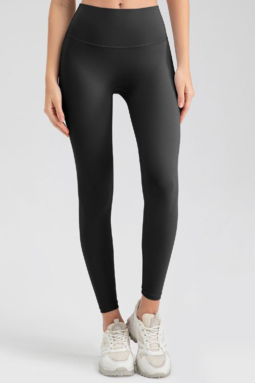 Women's black high-waisted sculpted contour leggings with a seamless fit.