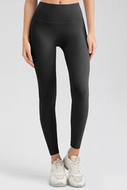 Women's black high-waisted sculpted contour leggings with a seamless fit.