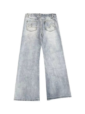 Men's light blue distressed full-length flare jeans with elastic waistband and embroidered back pockets.