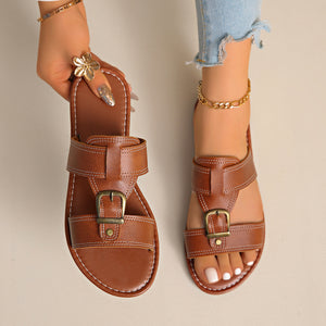 Chic brown PU leather slide sandals with adjustable buckles.
