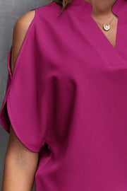 Open-shoulder blouse in Watermelon pink polyester with V-neck and keyhole detail.