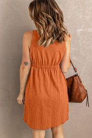 Gathered waistline button-down mini dress in Pumpkin Spice, sleeveless, casual style.