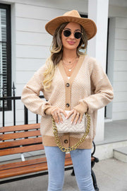 Chevron knit cardigan in tan with contrast trim, button front, and V-neck.