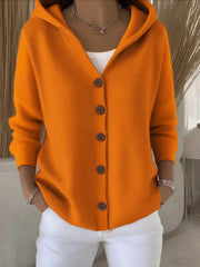 Orange hooded button-front knit cardigan with wooden buttons, styled casually.