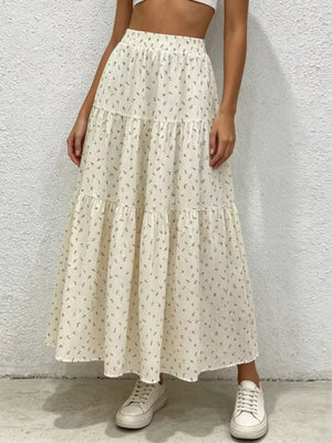 Ruched floral tiered maxi skirt in beige with a ruffled hem and elastic waist.