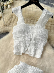 White textured two-piece set with ruffled details, button front, square neck, and cap sleeves.