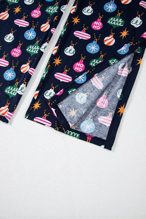 Navy blue lounge pants with festive bauble print and side slits.