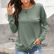 Henley-inspired drop shoulder sweatshirt in Matcha Green with button neckline and casual fit.