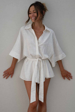 White linen kimono sleeve romper with tie waist and collar