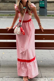 Maxi dress with red and white stripes, bow knot straps, and red trim.
