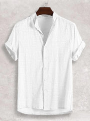 White textured band collar casual shirt with short sleeves and button front.