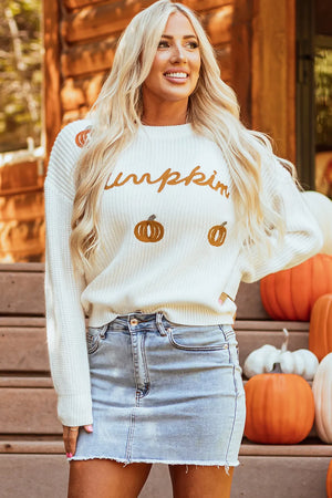 White acrylic crewneck sweater with embroidered pumpkin graphic and text.