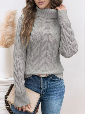 Grey cable-knit turtleneck sweater with ribbed cuffs and hem.
