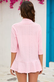 Pink perforated ruffle hem cardigan with 3/4 sleeves.