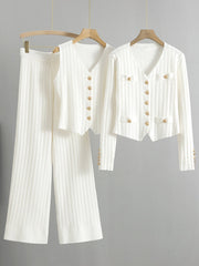 White ribbed knit outfit set with gold buttons, featuring a V-neck cardigan and wide-leg pants.
