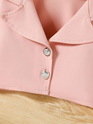 Pink toddler blazer with decorative buttons and a lapel collar.