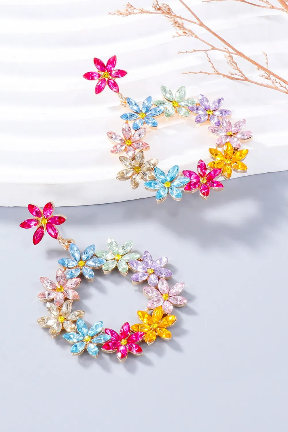 Floral halo drop earrings with multicolor crystal flowers and alloy metal.