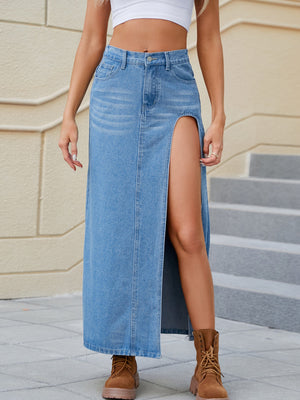 Denim maxi skirt in light wash with a bold high slit and buttoned front.