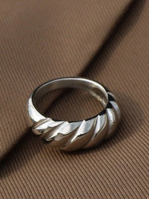 Sculpted steel croissant ring in silver with a twisted band detail.