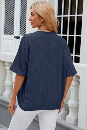 Dark blue textured open-front kimono sleeve top with a relaxed fit.