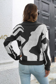 Women's abstract print polo knit sweater in black and white acrylic.