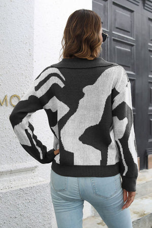 Women's abstract print polo knit sweater in black and white acrylic.