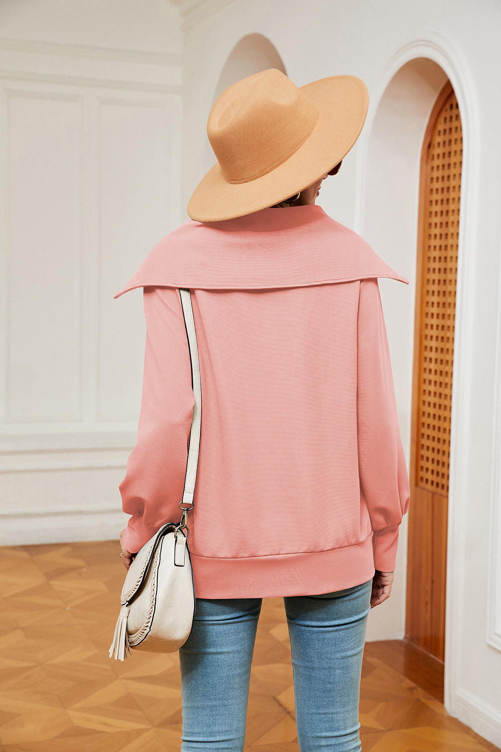 Peach wide collar zip-through sweatshirt with a relaxed fit and cuffed sleeves.