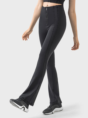 Black activewear pants with a zip front and flared leg