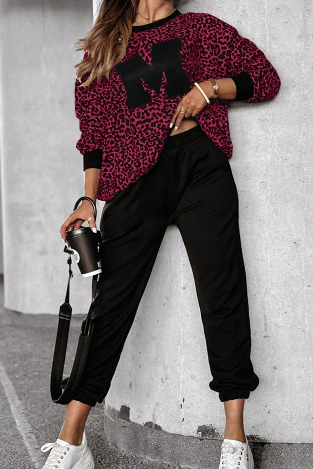 Burgundy leopard print loungewear set with black "M" appliqué on top and black joggers.