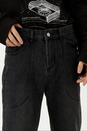 Black denim straight leg jeans with curved panel seams and front pockets.