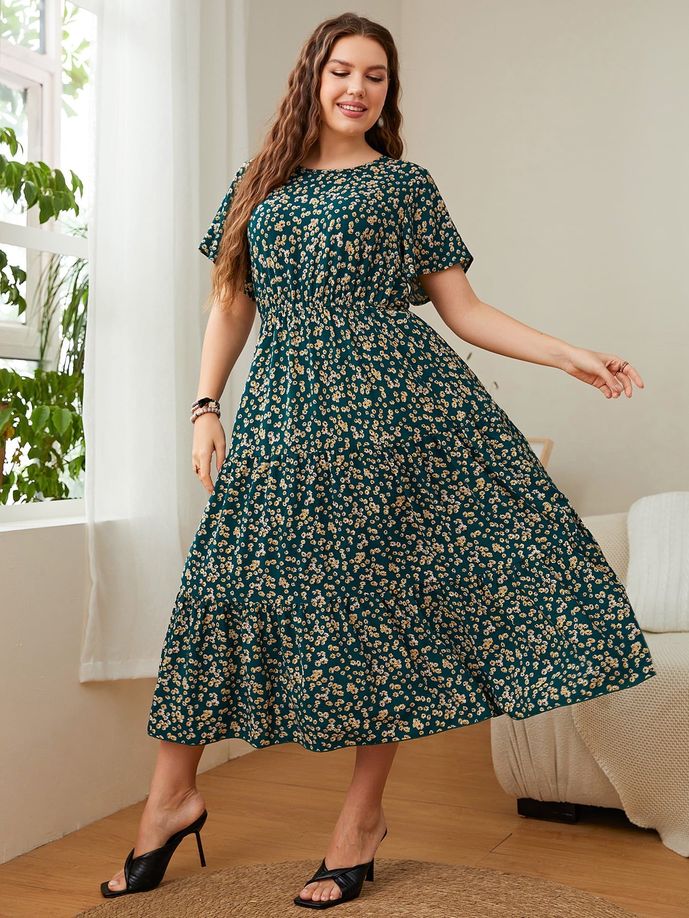Emerald floral midi dress with tiered skirt and short sleeves.