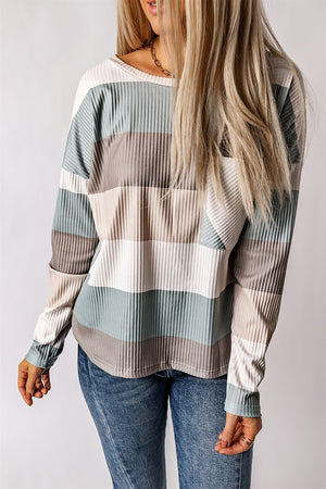 Ribbed stripe long sleeve top with patch pocket in neutral tones.