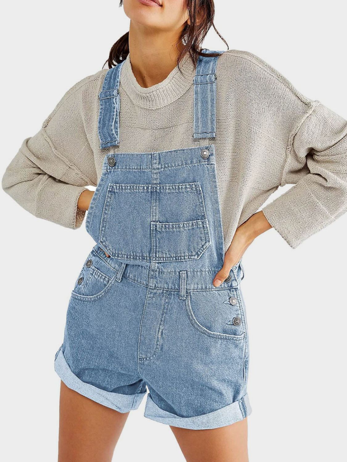 Light wash denim short overalls with rolled hem and front bib pocket.