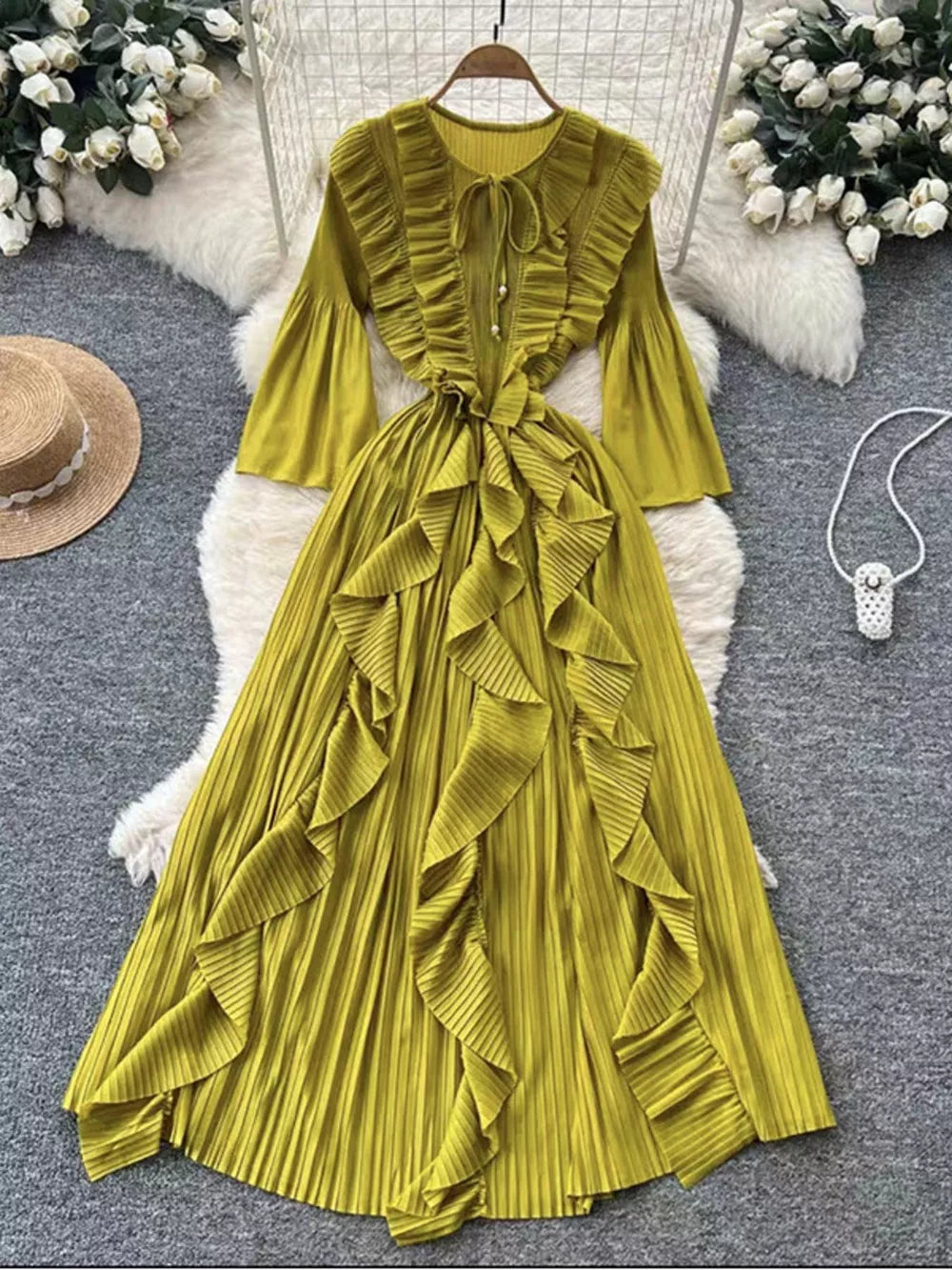 Green Yellow A-line midi dress with cascading ruffles, tie neck, and bell sleeves.