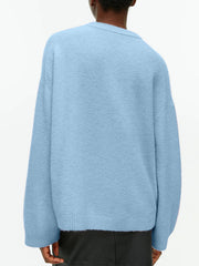 Light Blue oversized brushed knit crewneck sweater with crewneck and ribbed cuffs and hem.