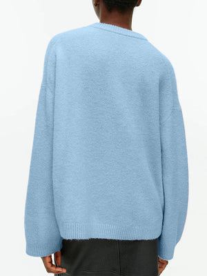 Light Blue oversized brushed knit crewneck sweater with crewneck and ribbed cuffs and hem.