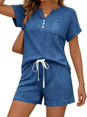 Blue ribbed knit loungewear set with short sleeves, henley neckline, pocket, and drawstring shorts.