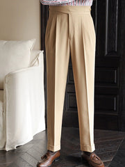Khaki pleated wide-leg dress pants with cuffed hem and a tailored fit.