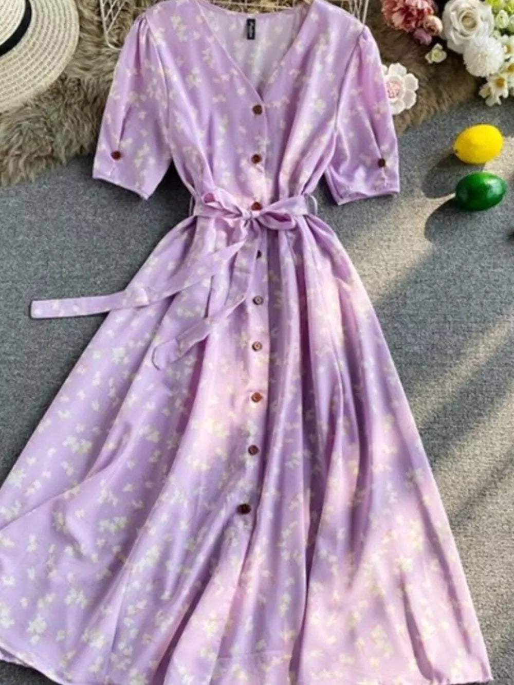 Violet floral V-neck midi dress with button front and belted waist