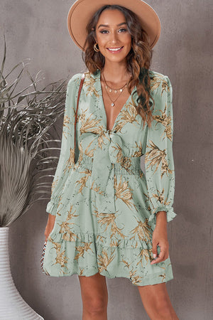 Tie-front prairie floral mini dress in Gum Leaf with smocked waist and ruffled hem.