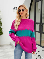 Colorblock ribbed sweater in hot pink and teal with a boatneck and long sleeves.
