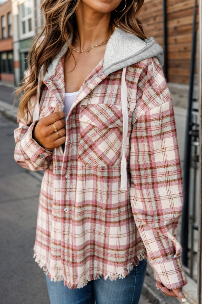 Hooded plaid shacket in blush pink with frayed hem and drawstring hood.