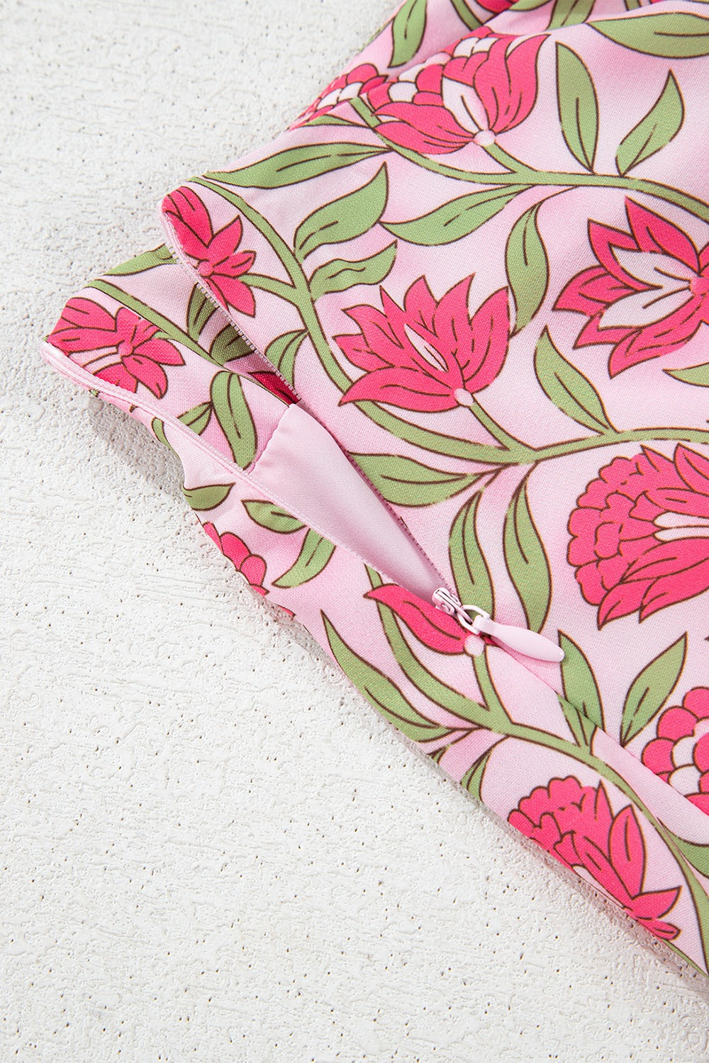 Floral print crop top and A-line skirt set in dusty pink with pink blooms and green leaves.
