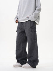 Grey cargo pants with versatile pockets and a relaxed fit.